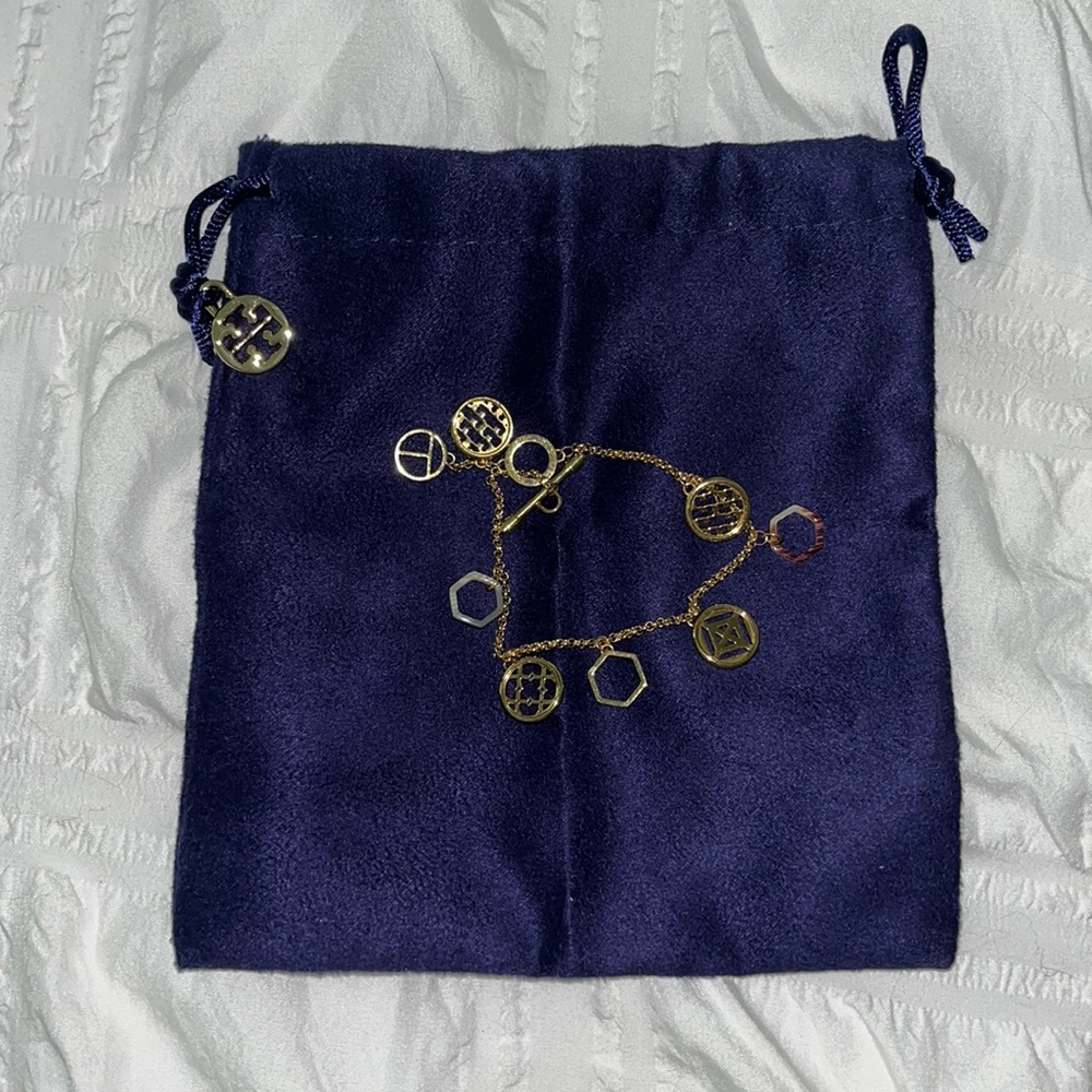 Brand new gold Tory Burch charm bracelet